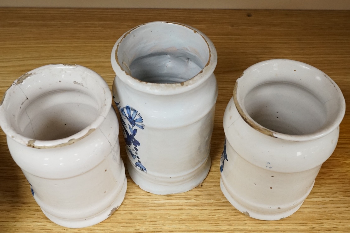 Three 18th century Delft blue and white drug jars; extract of rhubarb, Myrobol, and Conf. Hiacintor, largest 14cm high